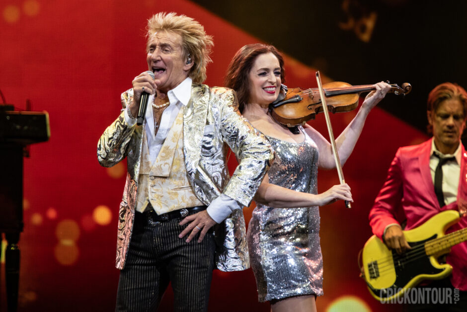 Rod Stewart poses with a band member during his performance at The Climate Pledge Arena