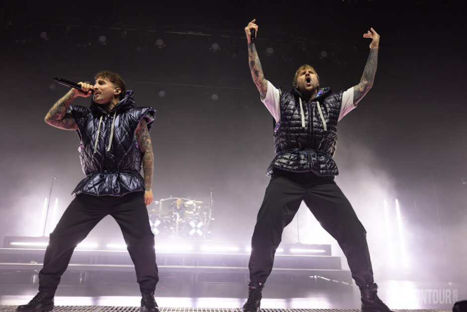 A high-energy image of the German electronicore band Electric Callboy performing at The Paramount Theatre.