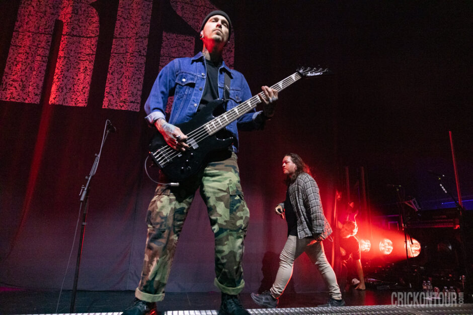 The metal band Polaris, standing center stage during a performance at The Paramount Theatre in Seattle, Washington
